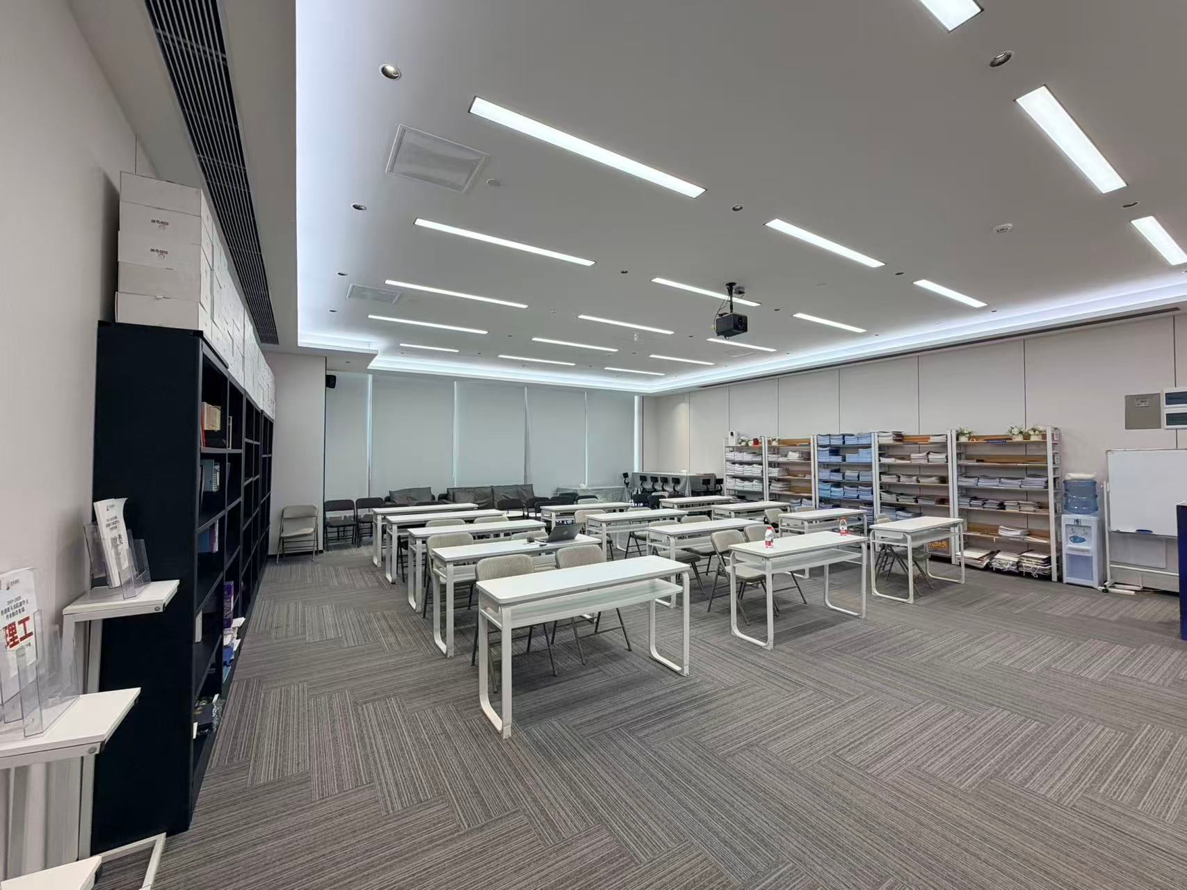Office meeting and training room with desks and a projector