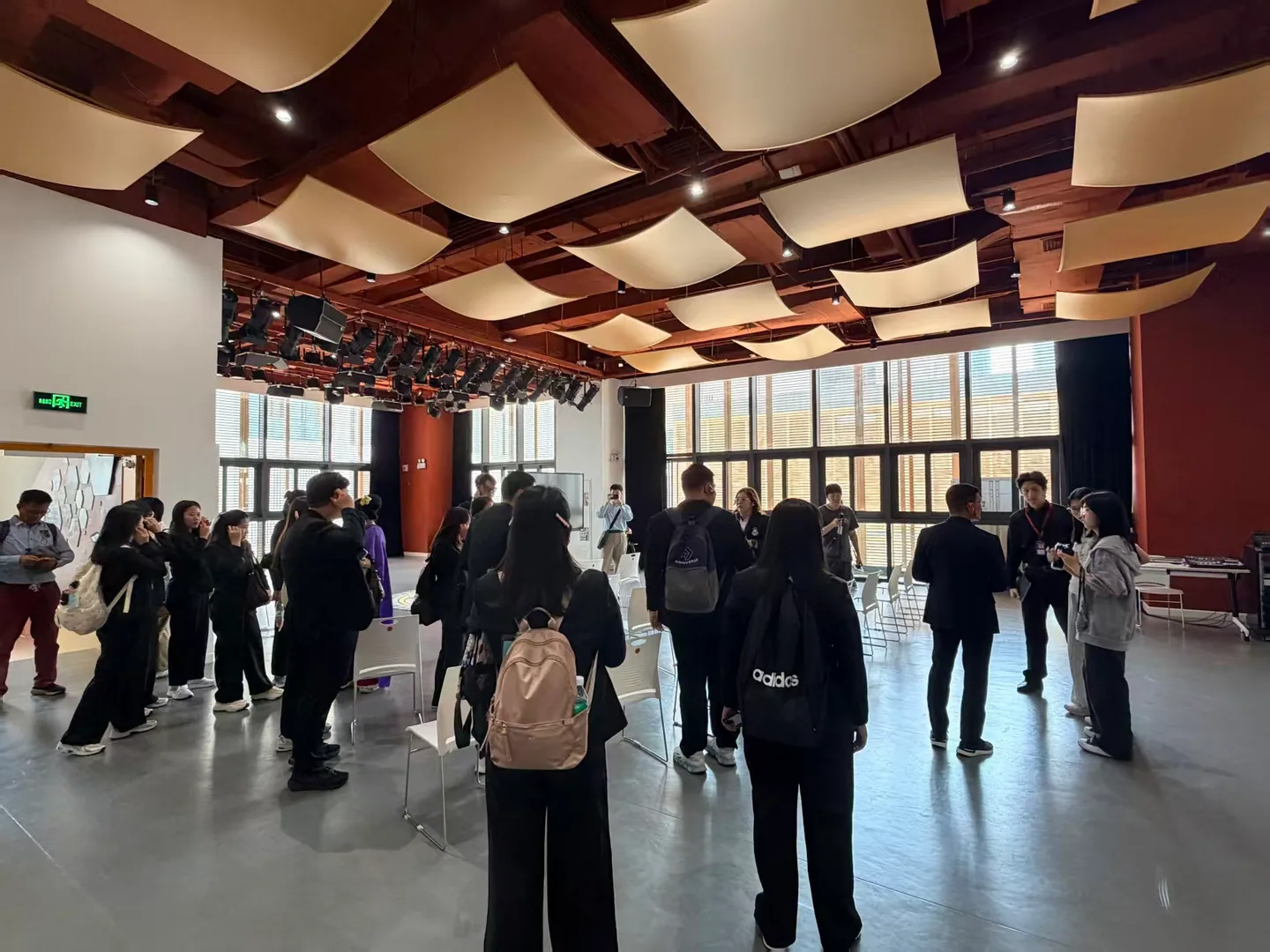 Visiting teachers and students exploring an arts learning space