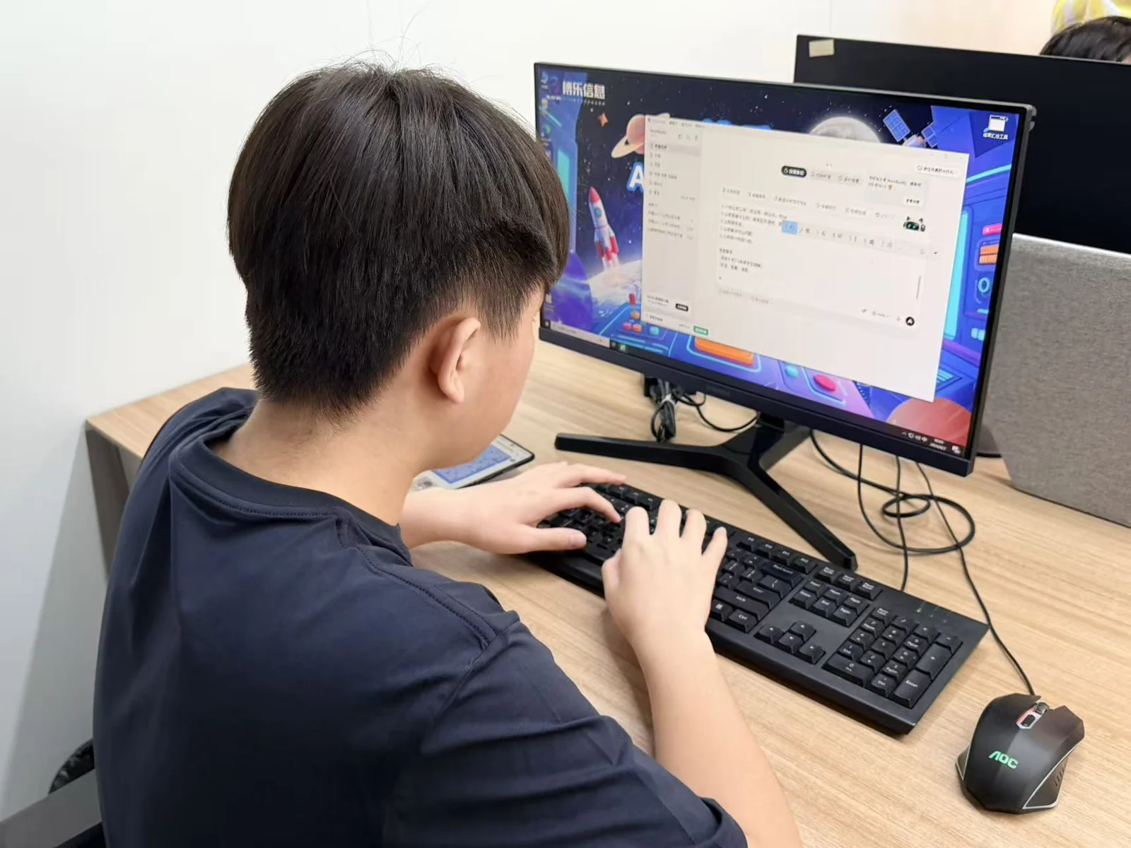 A participant working with AI tools at a computer during a previous activity